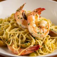 Shrimp Scampi · Jumbo shrimp & linguini noodles sautéed in a garlic butter white wine sauce & cherry tomatoes.