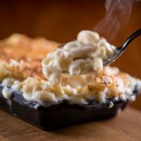 Traditional Mac & Cheese · Macaroni noodles, creamy sauce, Cheddar, Parmesan & gruyere cheese's - baked to perfection. ...