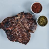 Dry-Aged Porterhouse 28 oz · 28 oz dry-aged beef porterhouse steak cooked to the desired temperature & choice of 2 STK sa...