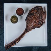 Dry-Aged Tomahawk 34 oz · 34 oz dry-aged tomahawk steak cooked to the desired temperature & choice of 2 STK sauces.