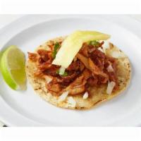 Al Pastor Taco · The ultimate Mexico City street taco. Thinly sliced, marinated Heritage pork served with cil...