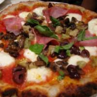 Capricciosa Pizza · Tomato sauce, mozzarella, artichokes, Italian ham, mushrooms and black olives. 