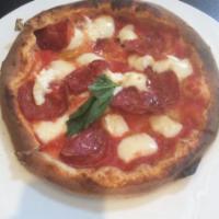 Ovest Pizza · Tomato sauce, mozzarella, Italian spicy salami, and ricotta.