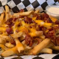 Loaded Fries · Crispy fries with melted cheese and bacon