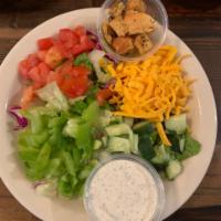 House Salad · Iceberg, romaine - choice of dressing green peppers, tomatoes, cucumbers, cheddar and crouto...