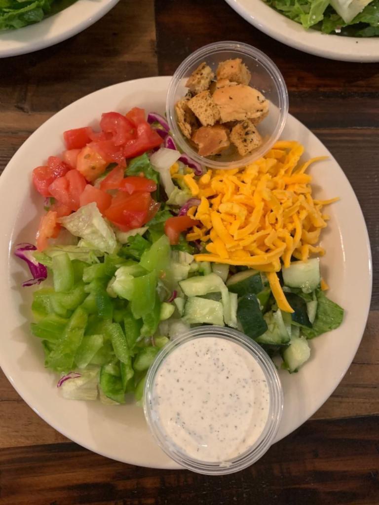 House Salad · Iceberg, romaine - choice of dressing green peppers, tomatoes, cucumbers, cheddar and croutons.