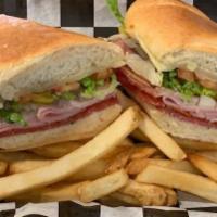 Italian Deli Sub · Ham, salami, pepperoni, onions, banana peppers, provolone and Italian dressing. Served on to...