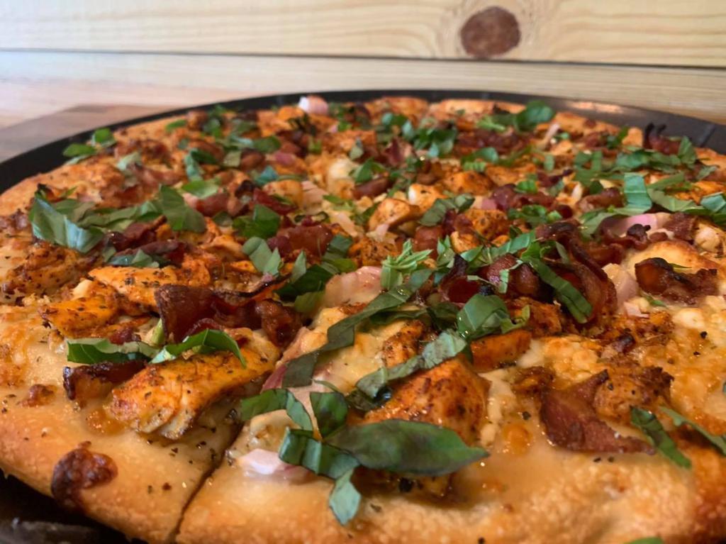 Black-N-Bleu · Thin Crust, Olive Oil and Garlic,  Blackened Chicken, Bacon, Bleu Cheese Crumbles,  Red Onions, Fresh Basil,  and a touch of honey