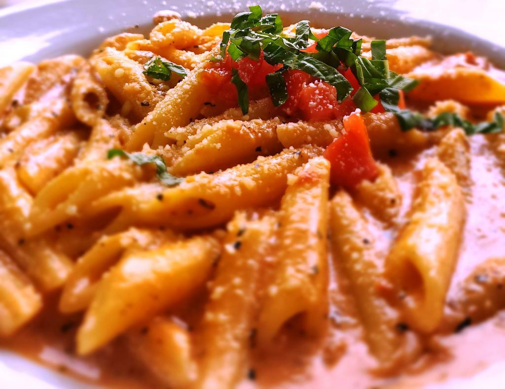 Penne Ala Vodka · Rich, creamy tomato sauce, lots of Parmesan, 
garlic, and a touch of vodka, topped with fresh basil 