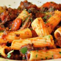 Sausage & Beef Rigatoni · Rich meaty Bolognese sauce, sliced rope sausage, sautéed green peppers, tomatoes, and onions...