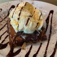 Ultimate Fudge Temptation · Rich chocolate chess pie topped with vanilla ice cream and hot fudge.