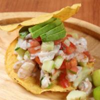14 oz. Ceviche Tostada · Crunchy tostasdas with shrimp bits and imitation crab meat marinated in lime juice mixed wit...