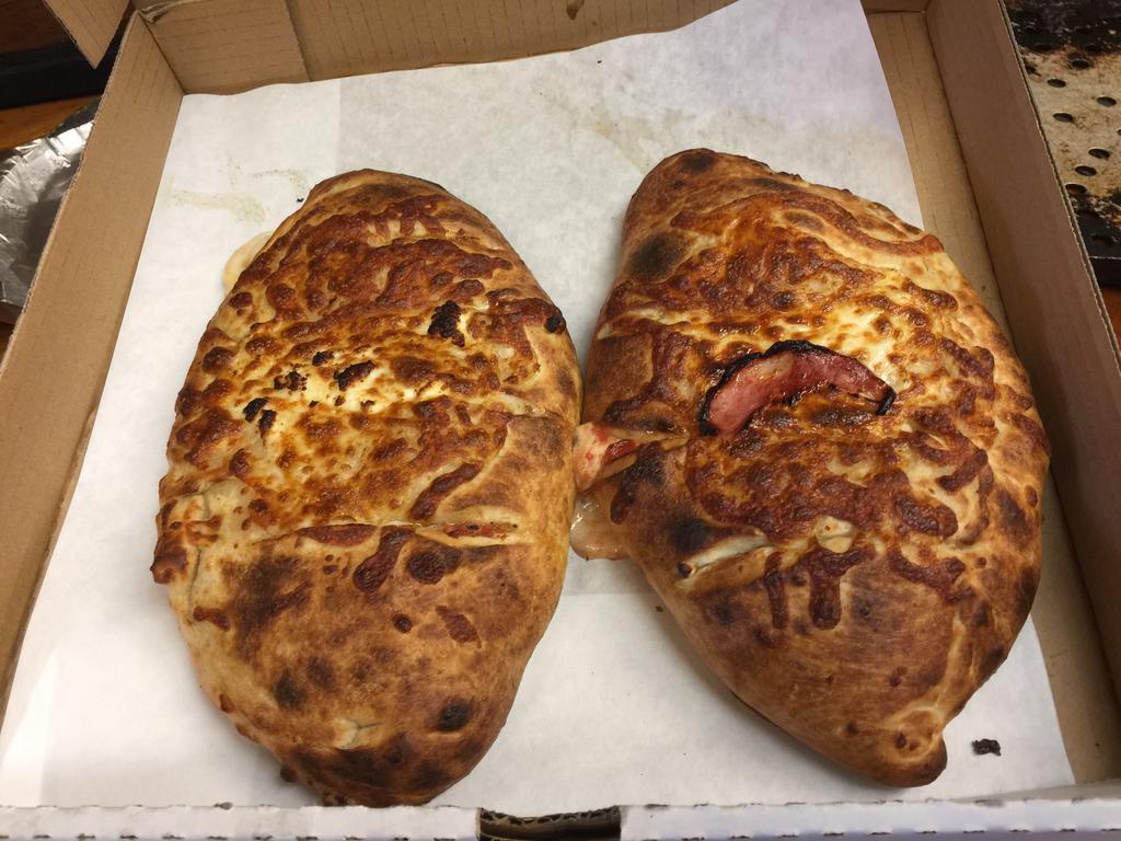 Design Your Own Zone Calzone · Choice of 3 toppings, mozzarella, and choice of sauce included.