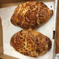 Meat Zone Calzone · Canadian bacon, Italian sausage, pepperoni, salami and pizza sauce.