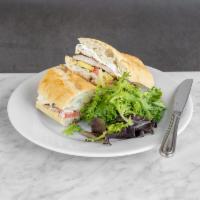 Chicken Aioli Sandwich  · Grilled Chicken, fresh mozzarella, avocado and tomatoes on a baguette, aioli dressing and gr...