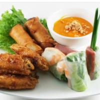 A1. Khai Vị Bon Mua - Bon Mua Sampler · 1 - fresh spring roll, 1 - pork spring roll, 2 - egg rolls, 4 - garlic chicken wings.