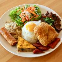 C1. Com Tam Bon Mua · Contains gluten. House special broken rice - topped with egg, shredded pork, steamed egg mea...