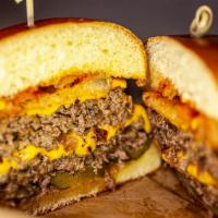 LOVONIA BURGER · half pound premium ground beef , ground by whole striploin, pickles, 
onion rings, and Ameri...