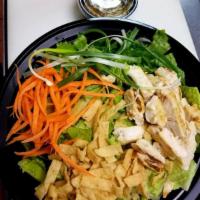 Chinese Chicken Salad · Romaine lettuce, green onion, shredded carrot and wonton strips with soy sesame dressing.