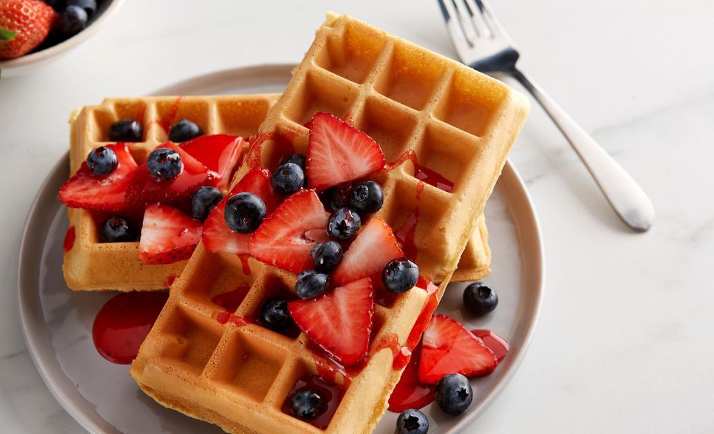 Malted Waffles · Buttermilk-malt waffles with whipped margarine and maple syrup. Add berries for an additional charge.