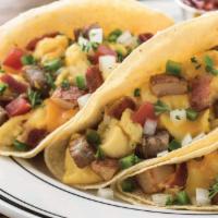 Farmhouse Breakfast Tacos · Hickory-smoked bacon, sausage, scrambled eggs, roasted potatoes, cheddar cheese, jalapeño, t...