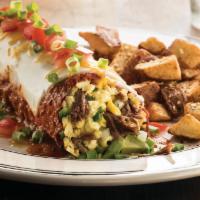 Breakfast Burrito · Flour tortilla stuffed with braised beef, melted jack and cheddar cheese, scrambled eggs, av...
