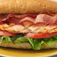Salmon BLT Sandwich · Grilled Alaska fillet served on a ciabatta roll with garlic aioli, lettuce, tomato and bacon...