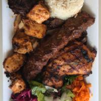38. Mixed Grill · Grilled chicken shish kebab, adana kebab, kofte kebab, chicken chops, and both chicken and l...