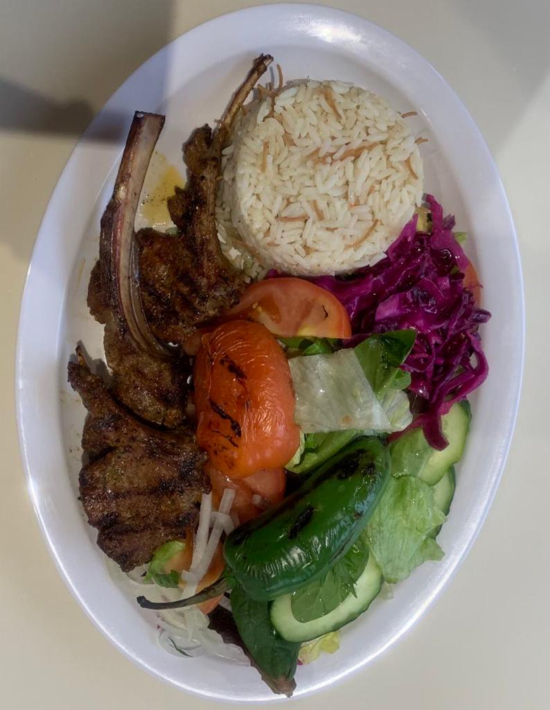 64. Lamb Chops · 3 pieces of grilled seasoned baby lamb chops served over rice and green salad