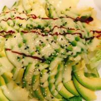 Avocado Salad · Fresh iceberg lettuce in the bottom with thin sliced avocado on top, serve with eel sauce an...