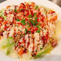 Kim Salad · Chef's signature salad, fresh iceberg  lettuce underneath with smoked salmon and crabmeat sa...
