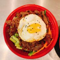 4. Bibimbap · Rice with assorted vegetables, beef and fried egg on top.