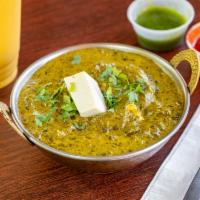 Saag Paneer · Homemade cheese cooked with spinach and spices.