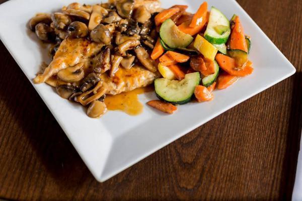 Chicken Marsala · Fresh tender chicken breast sauteed with fresh mushrooms in a classic imported Marsala wine sauce.