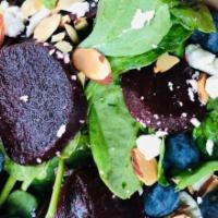 Smaak Salad  · Bed of baby spinach, sliced roasted beets, blueberries, chev ＆ toasted almonds. Served with ...