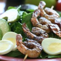 Kahuku Spinach Salad · Hard boiled egg, avocado, bacon, baby spinach, papaya seed dressing and grilled shrimp.