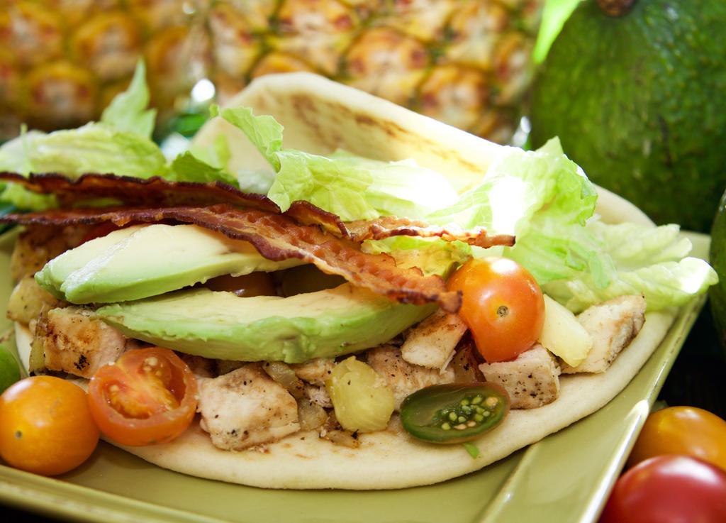 Aloha Pineapple Wrap · Grape tomatoes, bacon, avocado, grilled pineapple, provolone, romaine, mayonnaise, grilled chicken breast on pita bread.