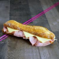 Parisian Sandwich · Baguette, ham, Swiss cheese, and butter. Contains wheat, milk.