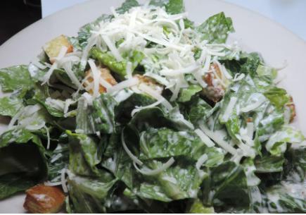 Caesar Salad · Chopped romaine, shaved Parmesan, and house-made croutons with Caesar dressing. Add protein for an additional charge.