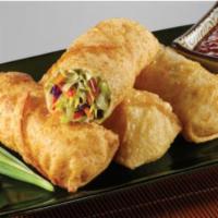 6 Vegetable Egg Rolls · Crispy dough filled with minced vegetables.