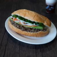 Sloppy Beef · Includes mayo, picked carrots and daikon, sliced jalapeño peppers, cucumber, onions and cila...