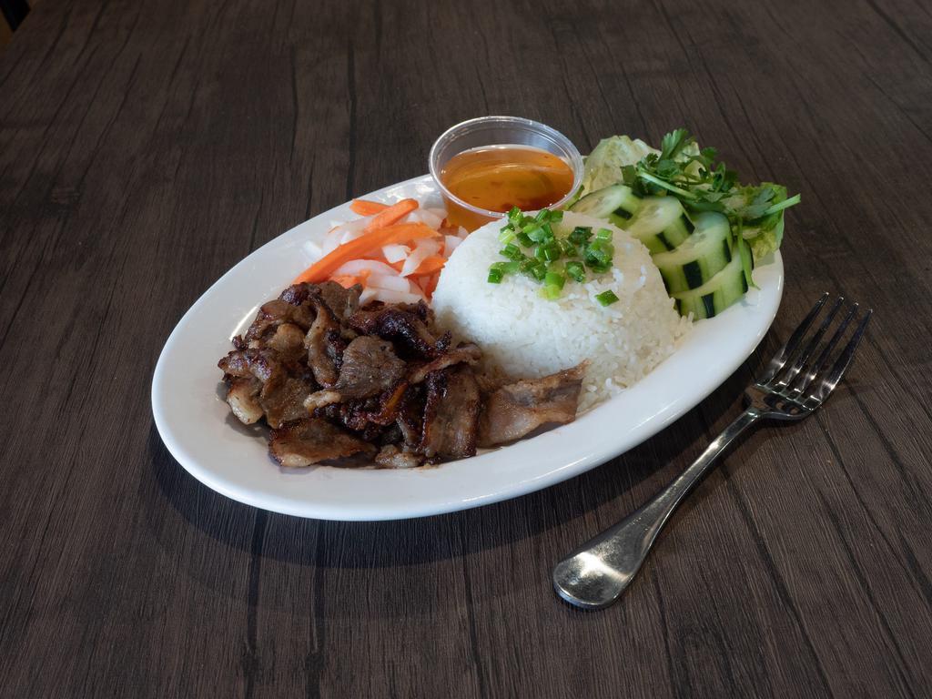 Rice plate · Includes grilled pork, cucumber, romaine lettuce, carrots & daikon and fish sauce.
