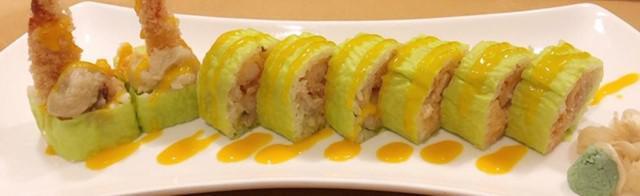 Paradise Roll · Shrimp tempura, fried banana and lobster salad wrapped with soy paper and mango sauce. Prepa...