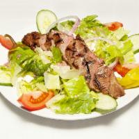Steak Salad · Marinated flank steak, iceberg lettuce, feta cheese, tomatoes, red onion, cucumbers, cherry ...