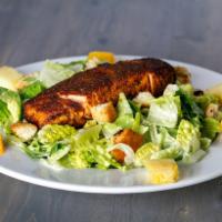 Blackened Salmon Caesar Salad · Spicy blackened fillet of salmon, romaine lettuce, garlic croutons, oranges, pineapple and C...