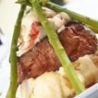 Filet Oscar · Filet mignon, topped with king crab, bearnase, Cabernet sauce, asparagus and mashed potatoes...