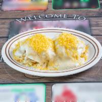 Snow Cone · Hash browns topped with a jumbo split biscuit, sausage patties, 2 eggs cooked to order and s...
