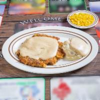 Hand Breaded Country Fried Steak · Pan-fried, served on top of a bed of homemade gravy. 