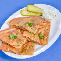 Arayes · Crispy, grilled pita bread sandwiches that are stuffed with seasoned ground beef. Comes with...