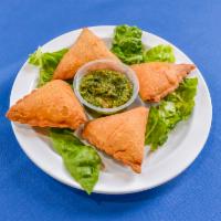 Sambosa · Thin pastry triangles, filled with mash potatoes, peas, carrots, spices and deep fried until...